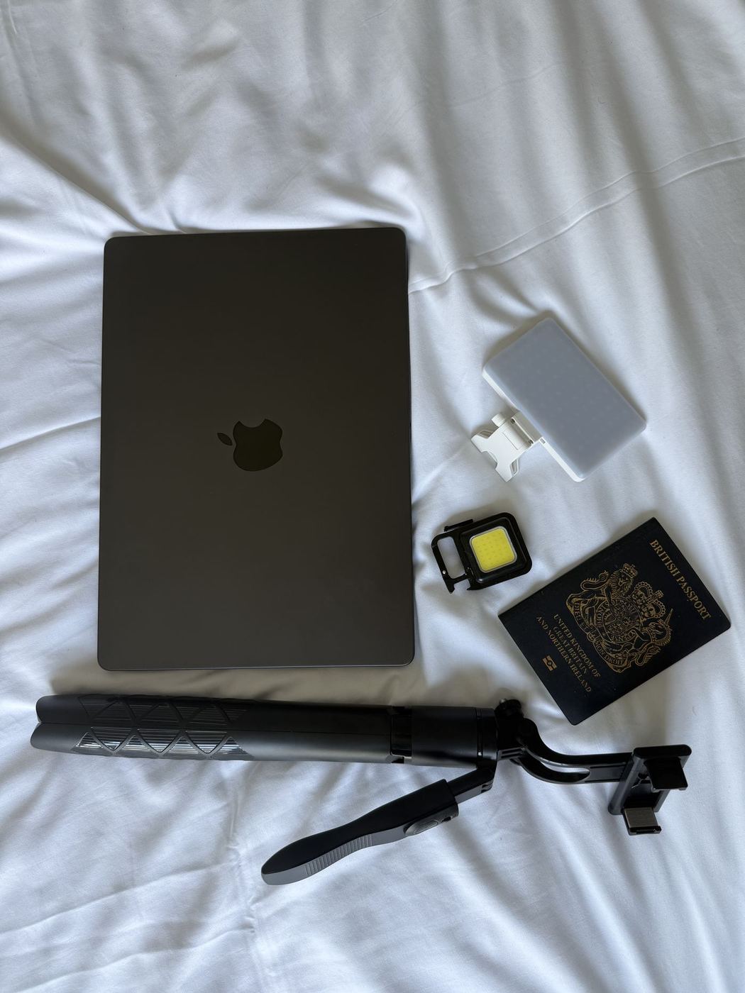 The laptop the hours happened on, with the little kit that runs the whole business