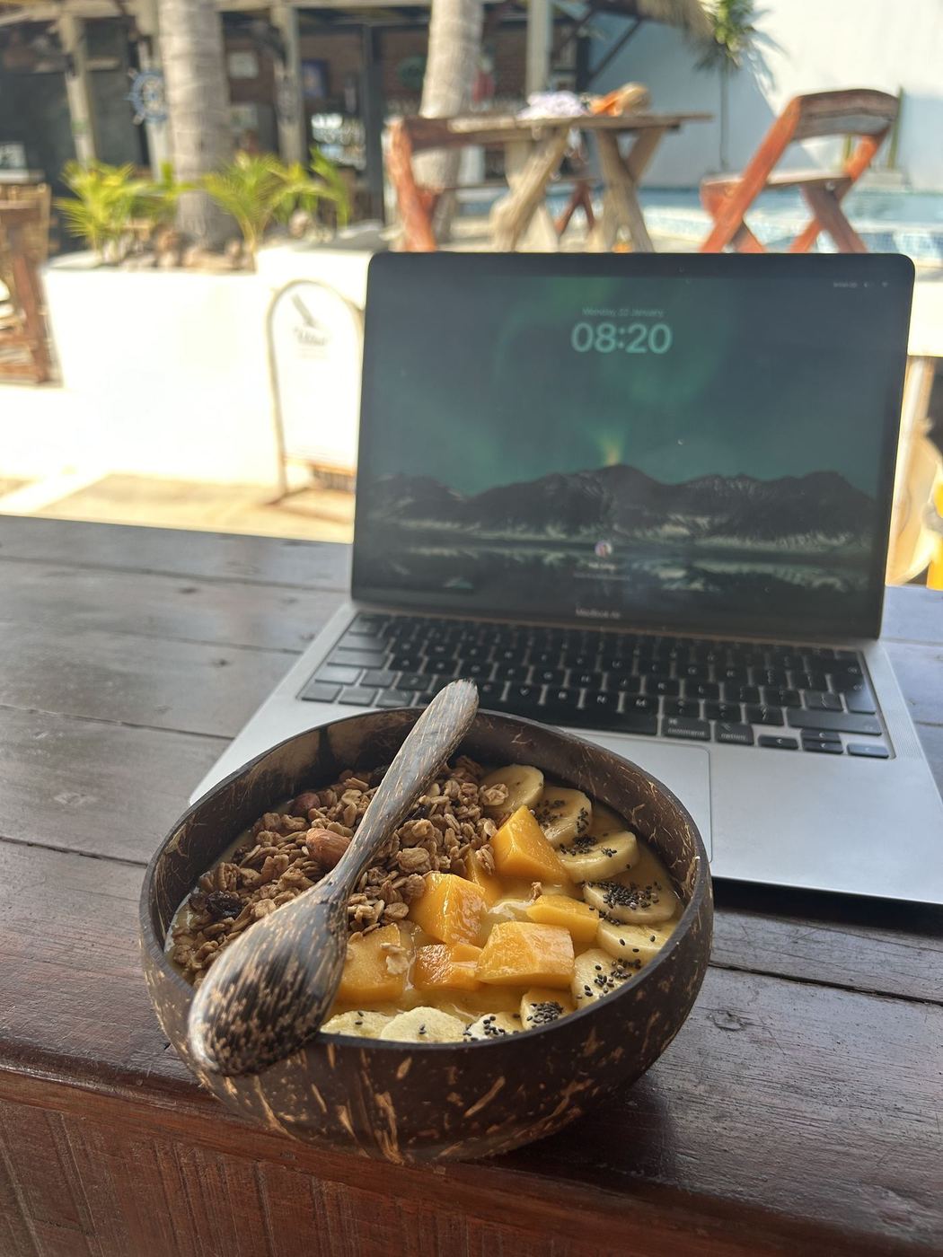 Morning coconut bowl next to the laptop, somewhere in South Thailand